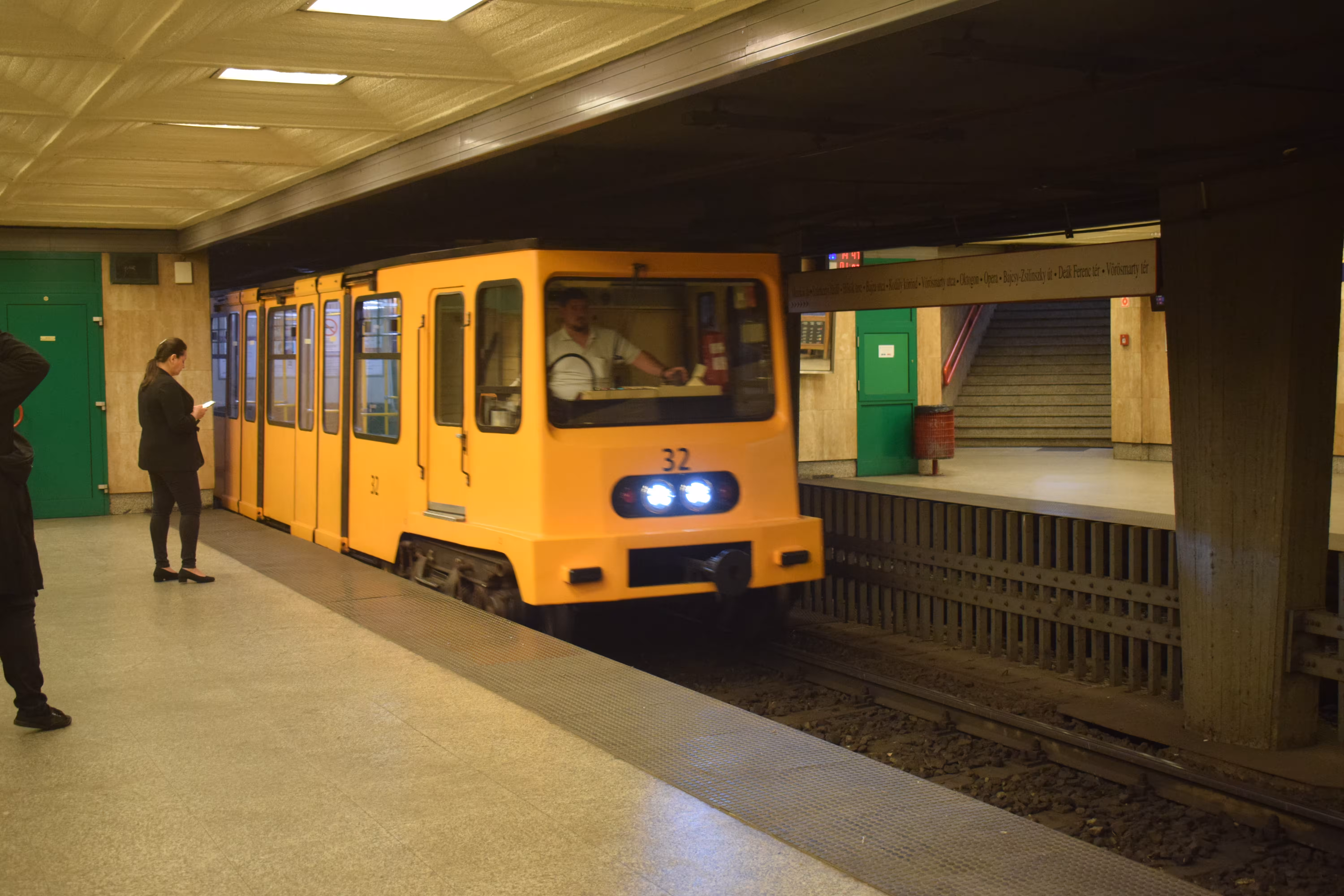A metro train entering a station.