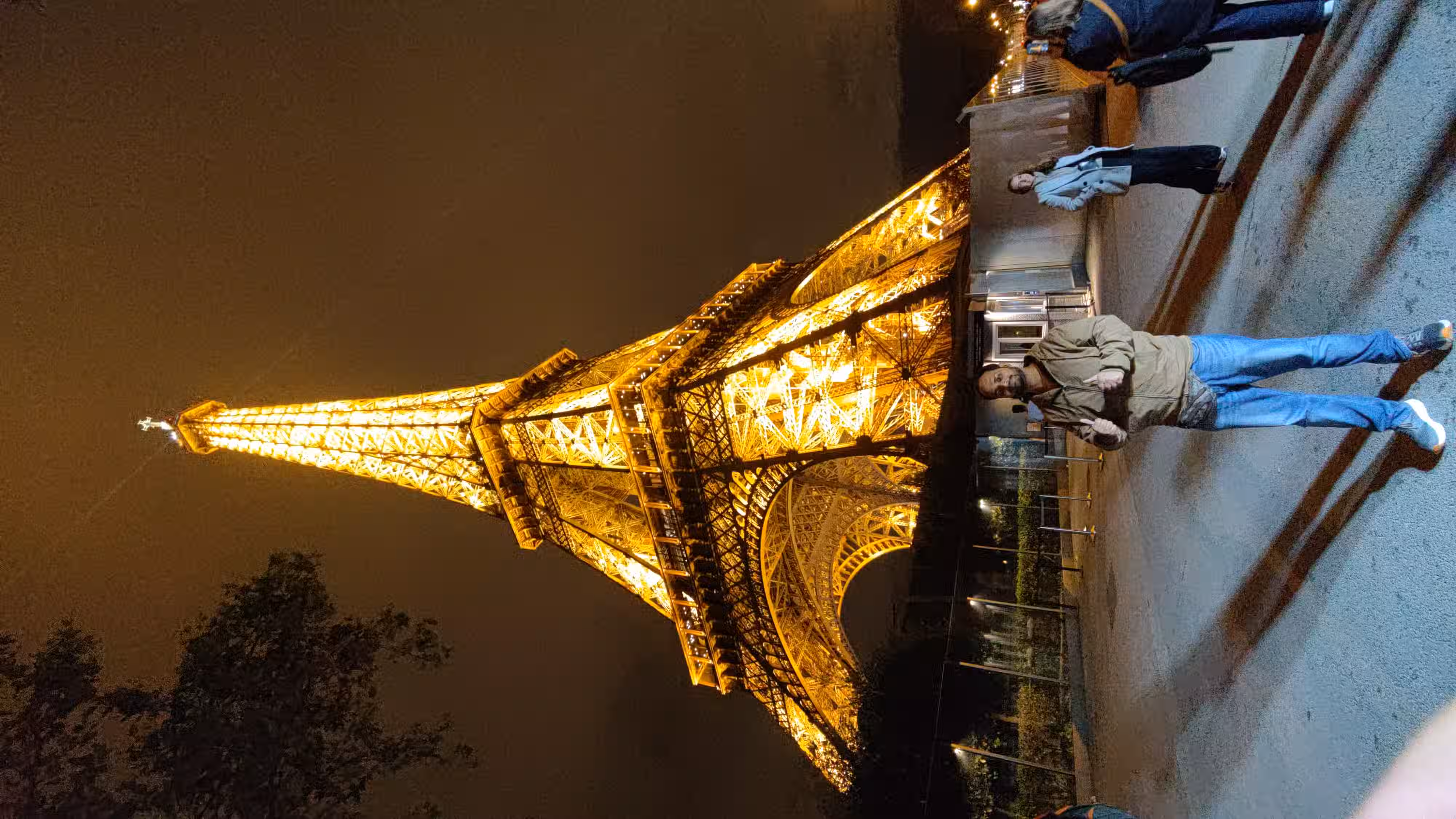 The Eiffel Tower lit with bright yellow