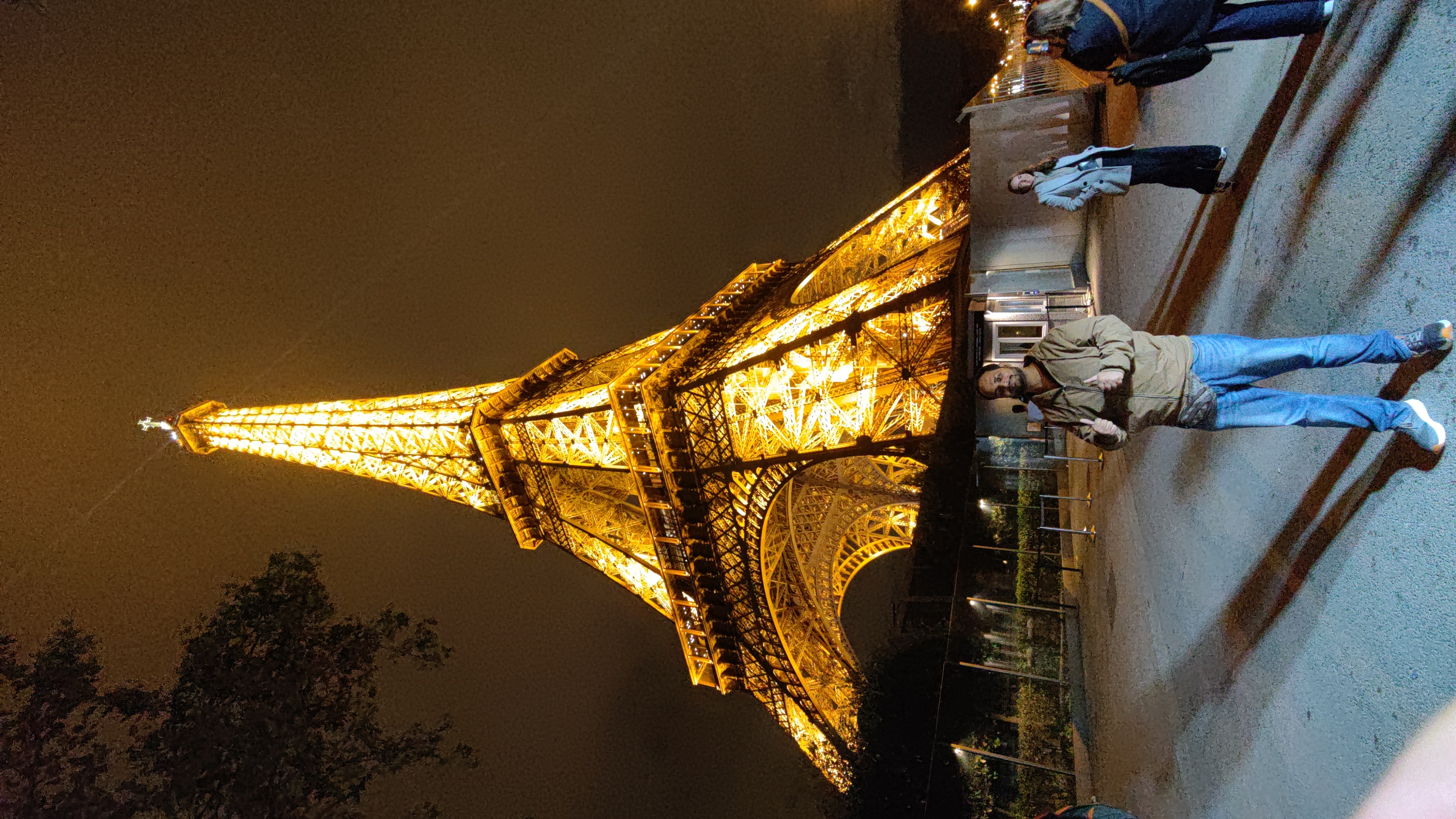 The Eiffel Tower lit with bright yellow