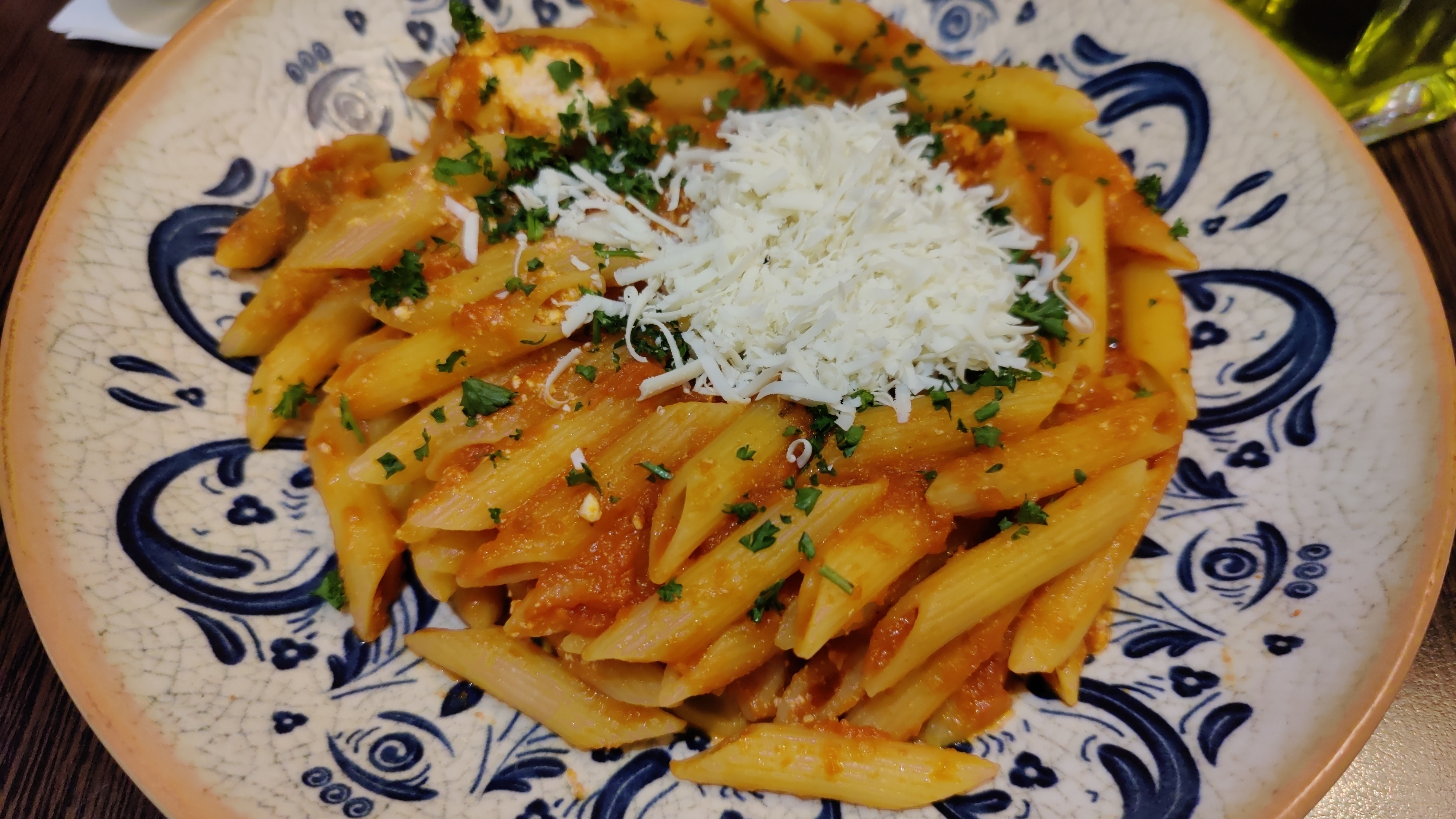 Pasta on a plate topped with Ricotta cheese
